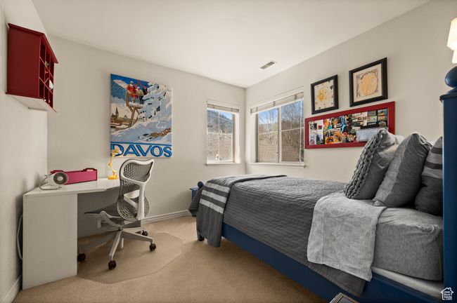 Bedroom featuring light carpet | Image 16