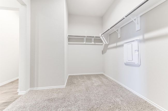 Large walk-in primary closet. | Image 21