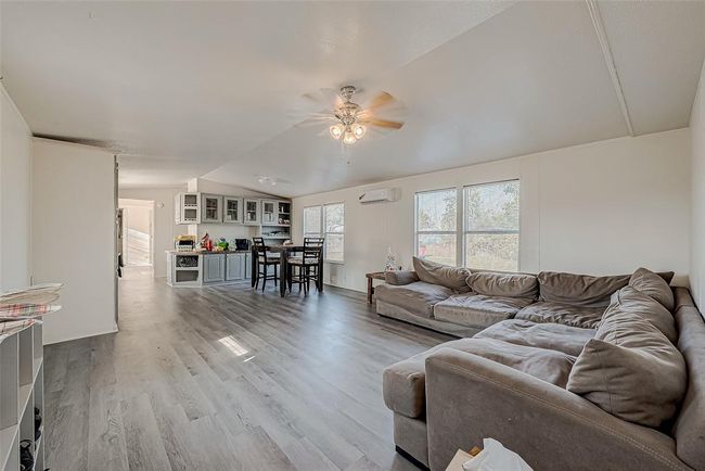 The front room offers a welcoming space with plenty of natural light. | Image 7