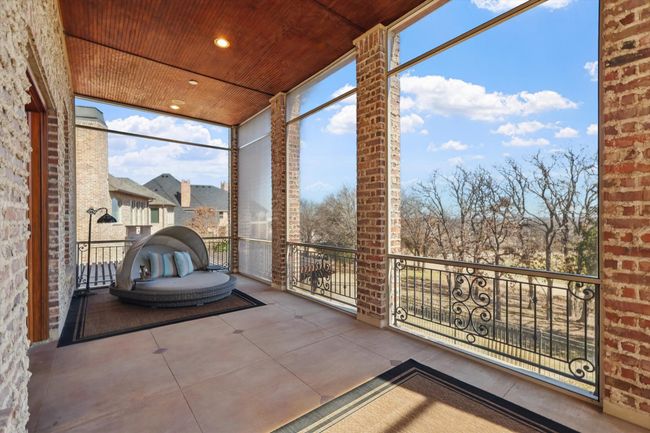 The screened in patio on the main floor has a beautiful view of the 17th green and allows for bug free entertaining. | Image 13