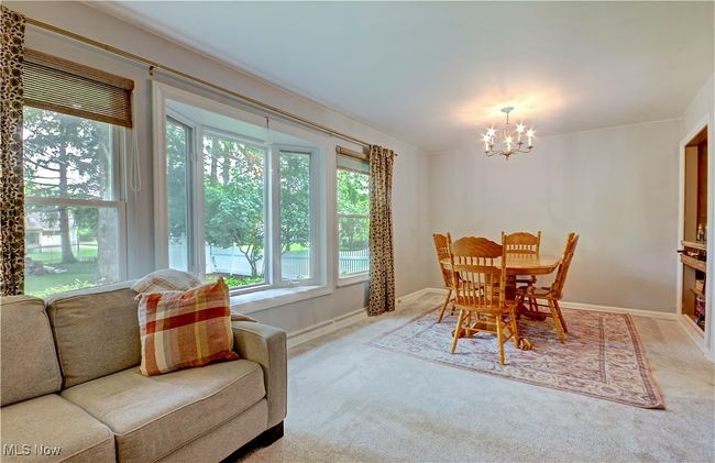 Dining room featuring a chandelier and carpet | Image 8