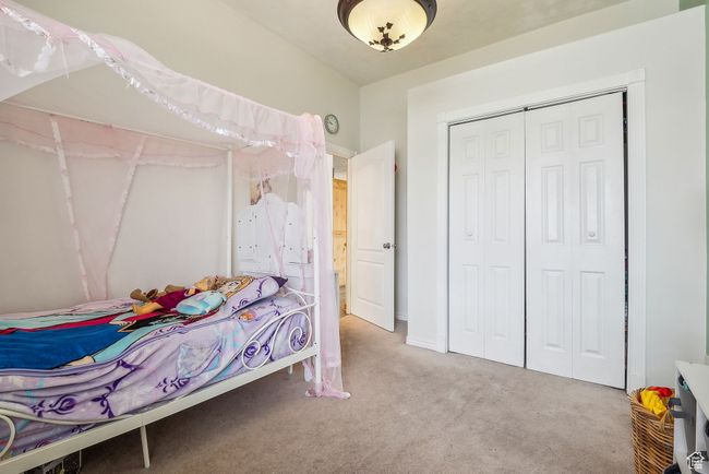 Carpeted bedroom featuring a closet | Image 28