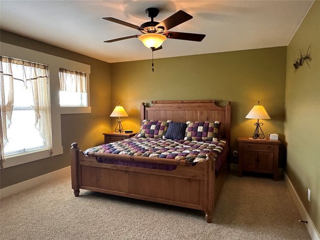 Bedroom with carpet floors and ceiling fan | Image 16