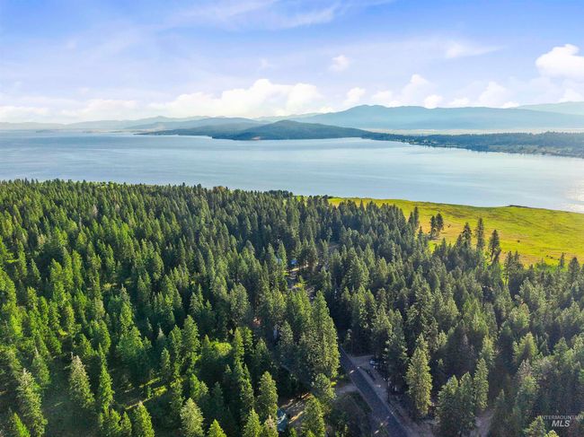 View of mountain backdrop featuring a nearby body of water | Image 11