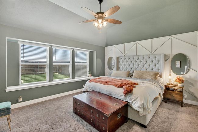 Bedroom with light carpet, lofted ceiling, and a ceiling fan | Image 23
