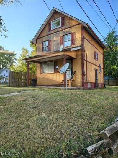 Rear view of house with a yard | Image 3