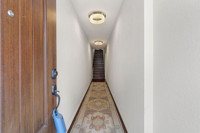 First Floor Entry Corridor featuring 2 designer flush lights, and baseboards | Image 34