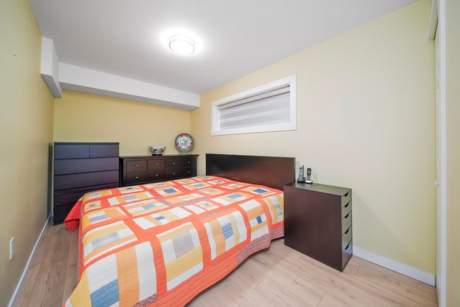Bedroom with baseboards and light wood finished floors | Image 28
