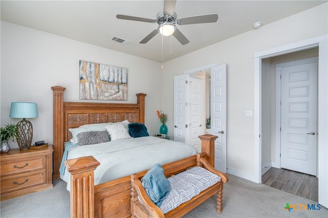Primary bedroom toward bathroom. | Image 18