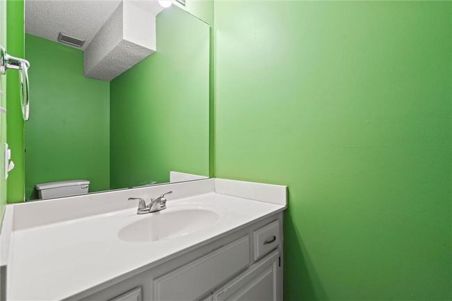 Bathroom with vanity and a textured ceiling | Image 34