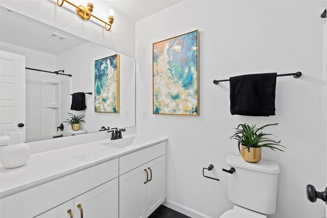 Bathroom with vanity, a shower, and toilet | Image 21