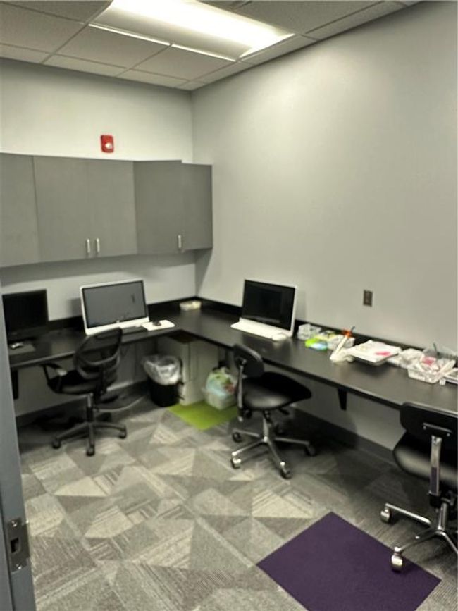 Home office featuring a drop ceiling and light colored carpet | Image 12