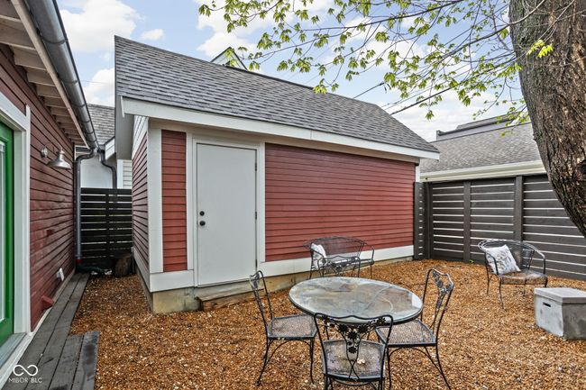 view of patio / terrace featuring a 1 car garage and full fence | Image 31