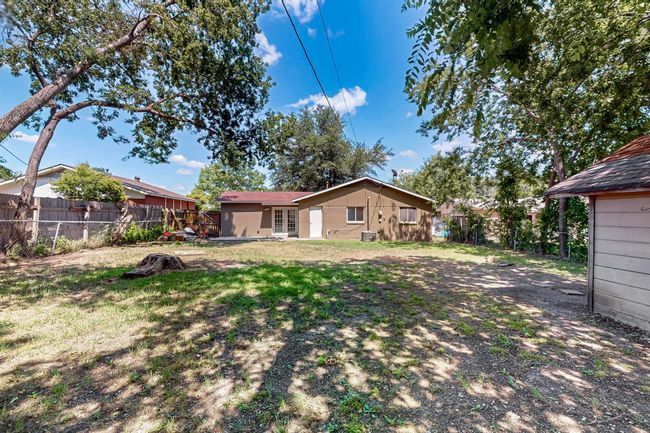Rear view of house with a fenced backyard | Image 27