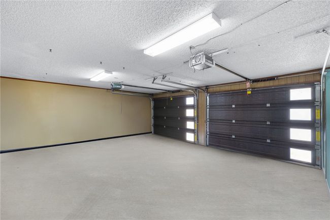 Garage with a garage door opener | Image 39