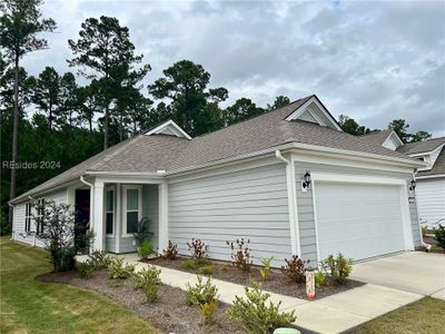 Single story home with a garage and a front lawn | Image 2