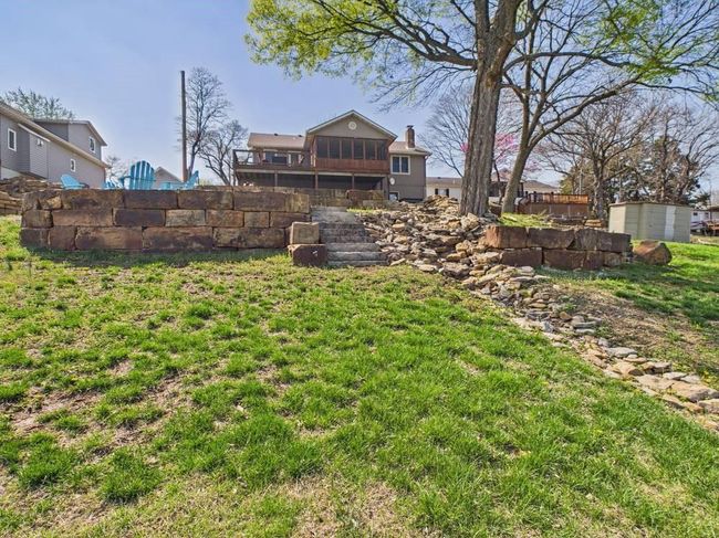 View of yard with view of stone steps | Image 8