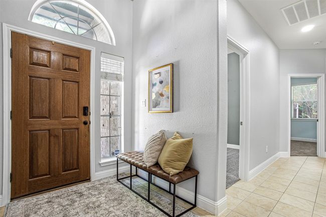 Entryway featuring baseboards and light tile patterned flooring | Image 11