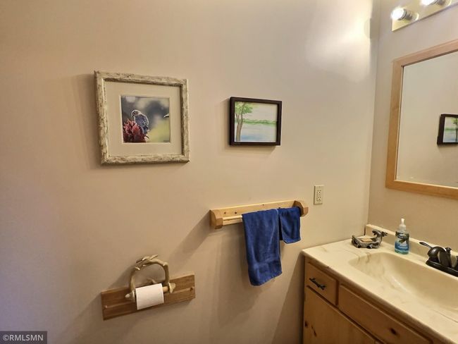Great for when guests visit or to clean up after yard work, is the half bathroom located on the main level. | Image 15