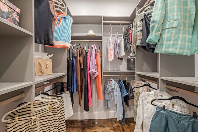 Walk in closet with wood finished floors | Image 19