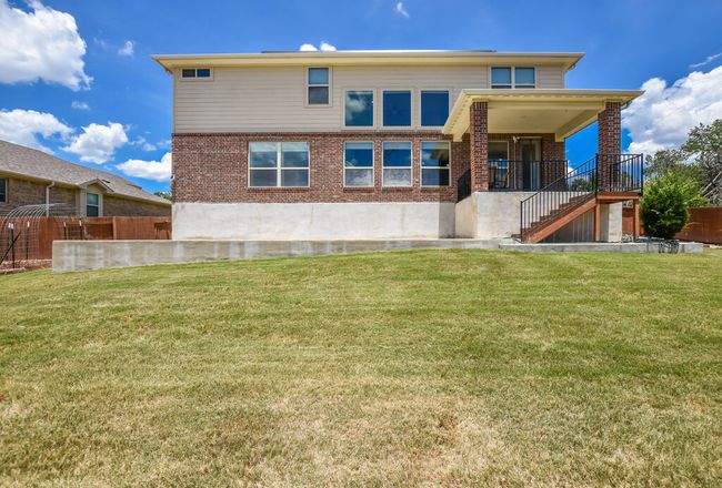 Back of house with stairs and brick siding | Image 40