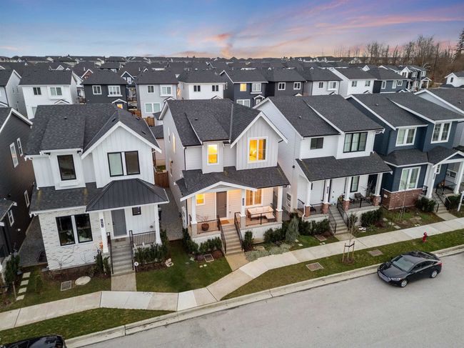 View of front facade featuring a residential view, board and batten siding, and roof with shingles | Image 38