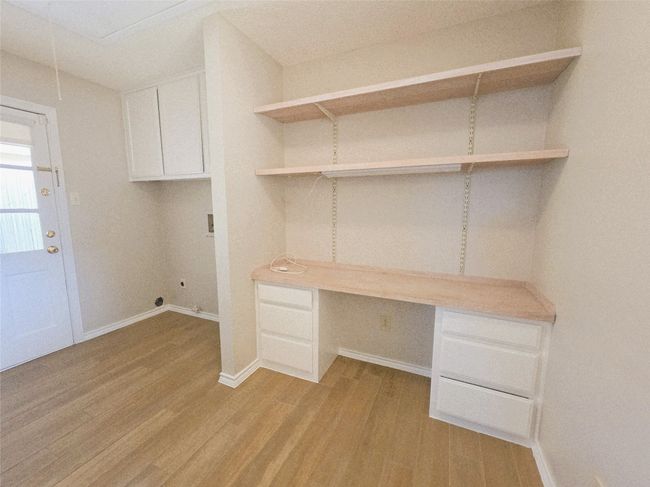 Laundry room with built in desk | Image 26