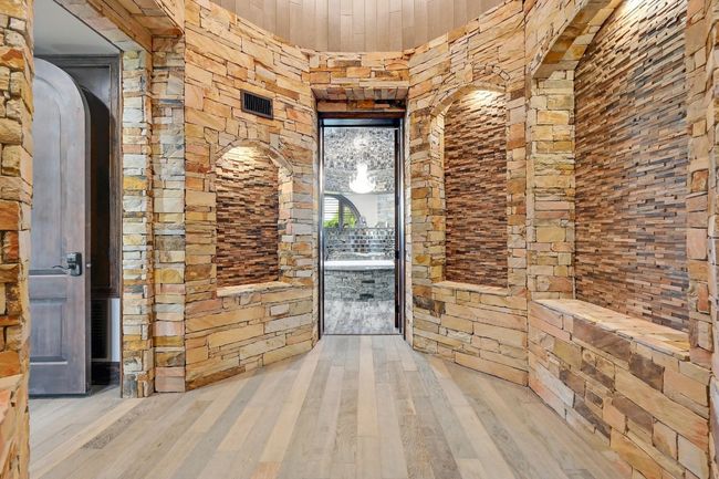 Corridor with arched walkways, wood finished floors, visible vents, and wooden​​‌​​​​‌​​‌‌​‌‌​​​‌‌​​‌‌​‌​​​​​‌ ceiling | Image 23