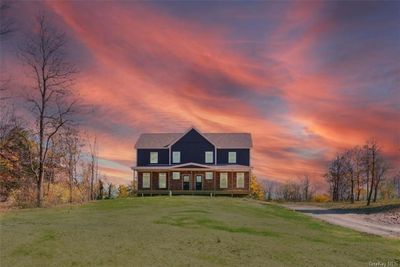 View of front of house featuring a yard and covered porch | Image 2