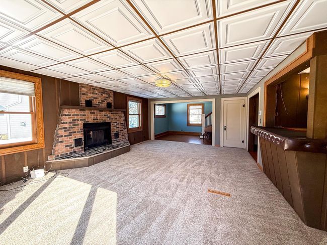 Family room connects to activity area leading to upper level | Image 13