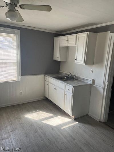 Kitchen with white cabinets | Image 3