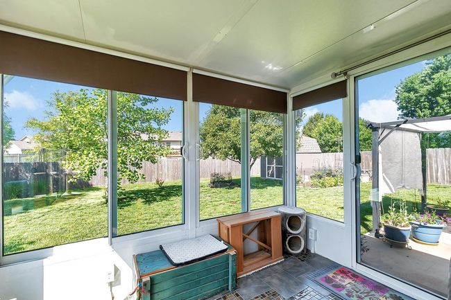 Sunroom featuring plenty of natural light | Image 19