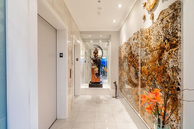 Hallway with elevator, recessed lighting, and light tile patterned floors | Image 8