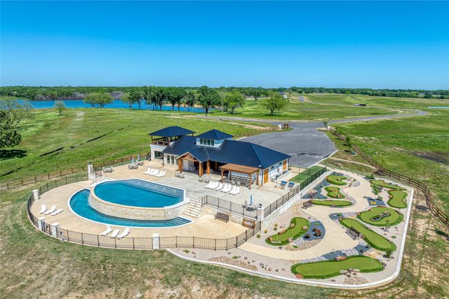 View of swimming pool featuring a water view, putt putt course | Image 18