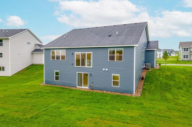 Generous yard space with wooded views—ideal for outdoor living, recreation, or future customization. | Image 41