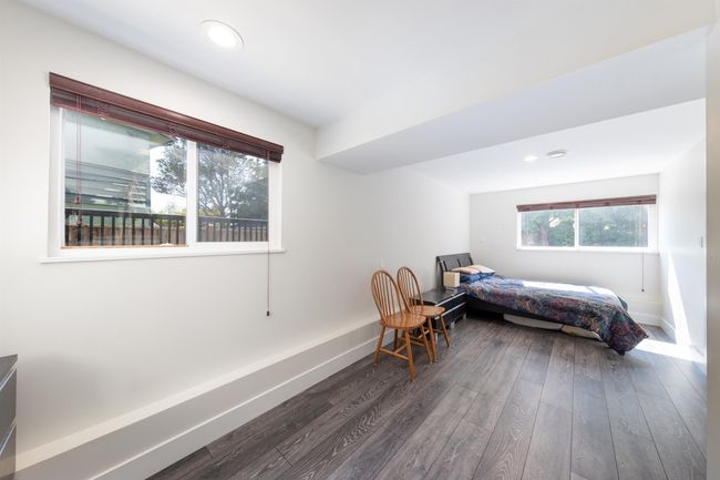 Bedroom featuring wood finished floors, baseboards, and recessed lighting | Image 34