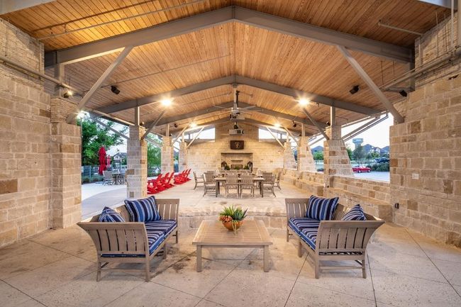 Trinity Falls patio with a gazebo, an outdoor living space with a fireplace, and outdoor dining area | Image 34
