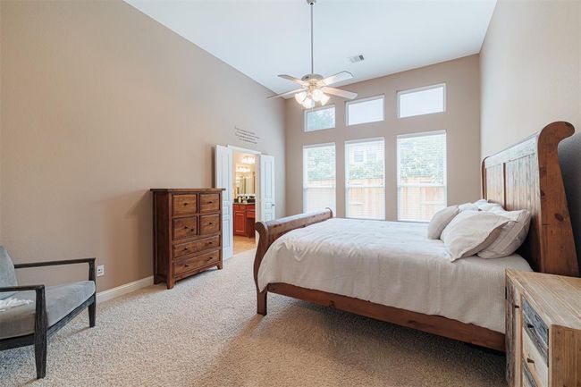 Lovely primary suite with high ceilings and ensuite bath. | Image 24