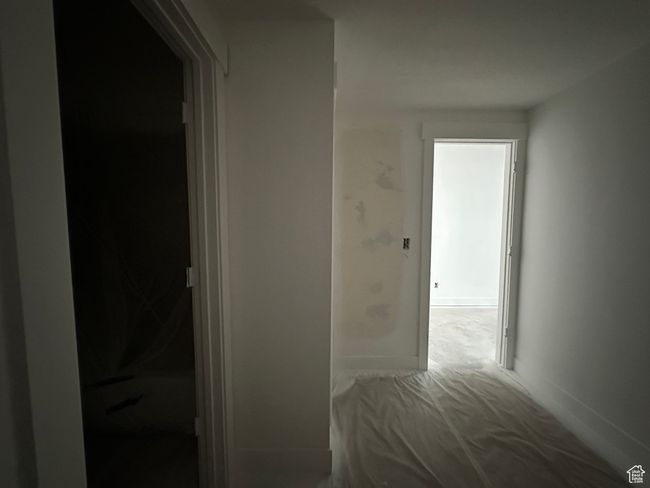 Hall with carpet and baseboards | Image 33
