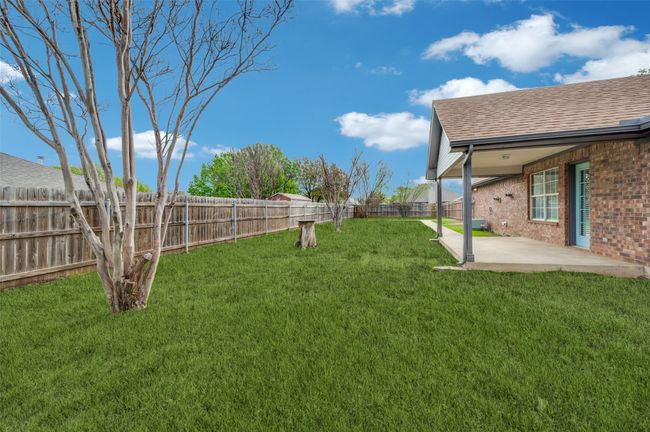 View of yard with a fenced backyard and a patio | Image 28