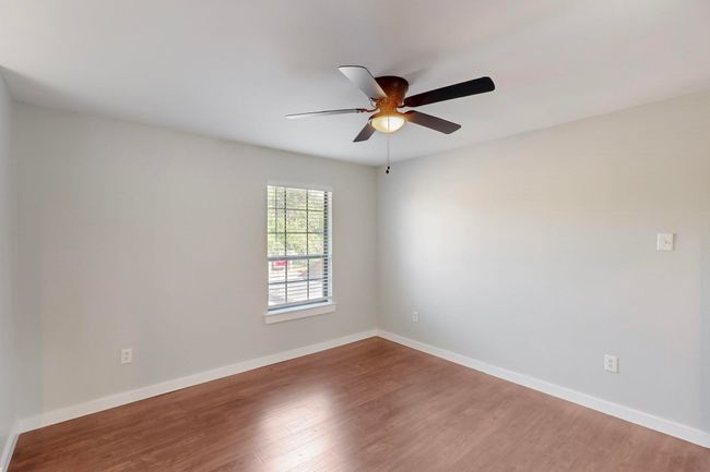 Unfurnished room featuring baseboards, wood finished floors, and ceiling fan | Image 19