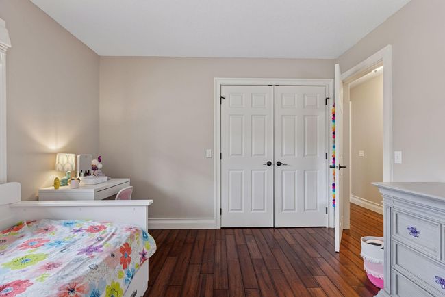 Main floor bedroom has a lighted closet and built in's. | Image 24