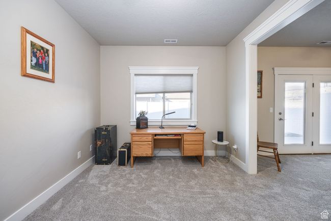 Home office featuring light carpet | Image 6