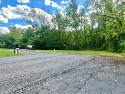 Last home on a dead end with Geddes Brook running thru property | Image 3