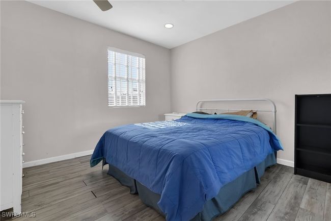 Bedroom featuring recessed lighting, finished floors, and baseboards | Image 15