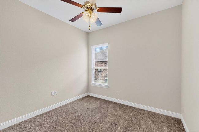 Carpeted spare room with baseboards and ceiling fan | Image 28