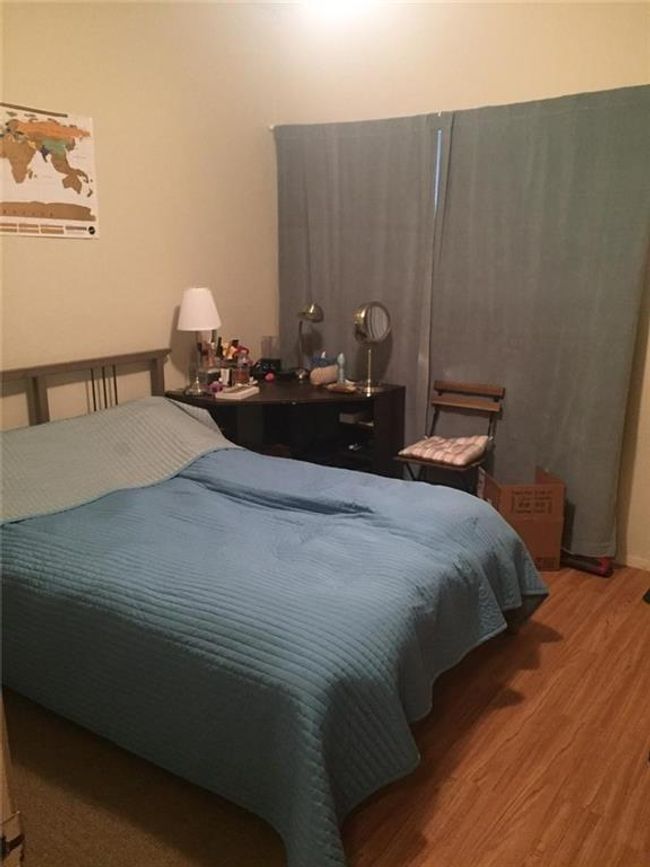 Bedroom with wood finished floors | Image 5