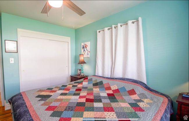 Bedroom featuring ceiling fan | Image 19