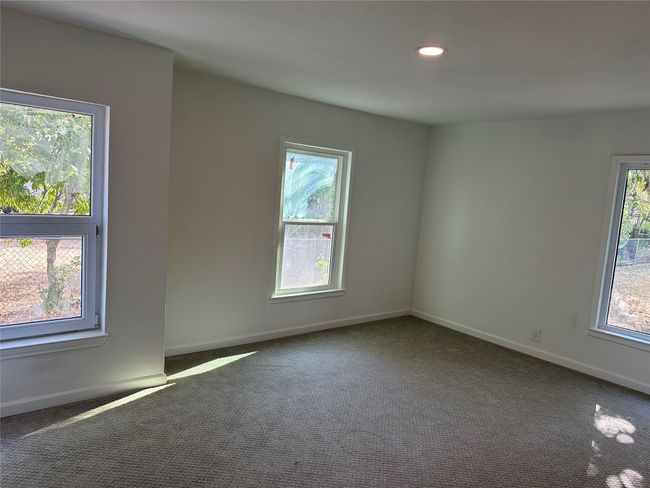 Carpeted empty room featuring baseboards and recessed lighting | Image 19