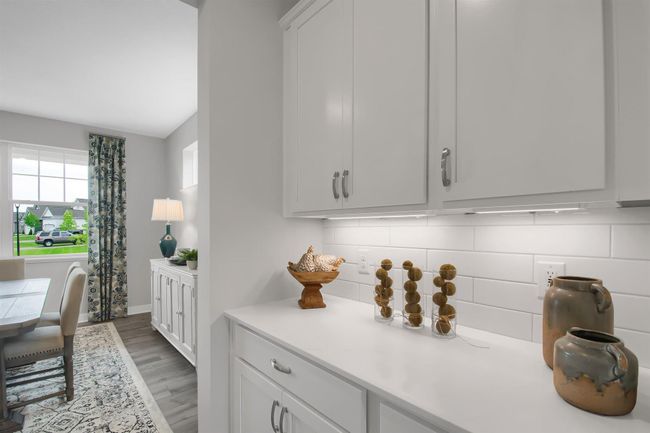 Butler's pantry conveniently located between the kitchen and dining room. Imagine entertaining here! Model photos. Options and colors will vary. | Image 10